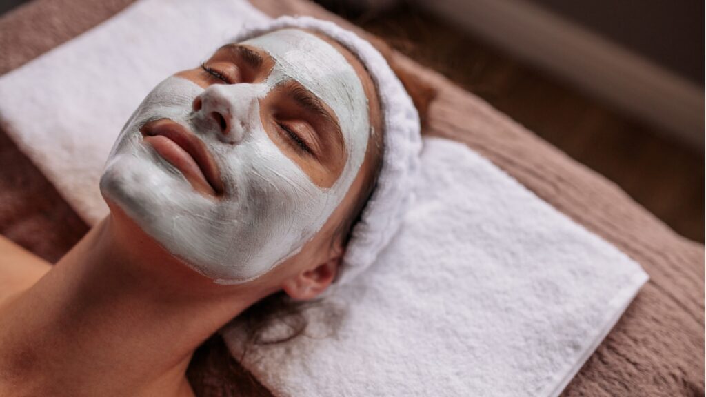 woman with cosmetic face mask in spa picture id896349366